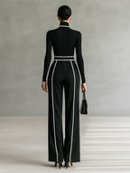 Two-piece women’s set with high-neck long-sleeve top, wide-leg trousers, and belt
